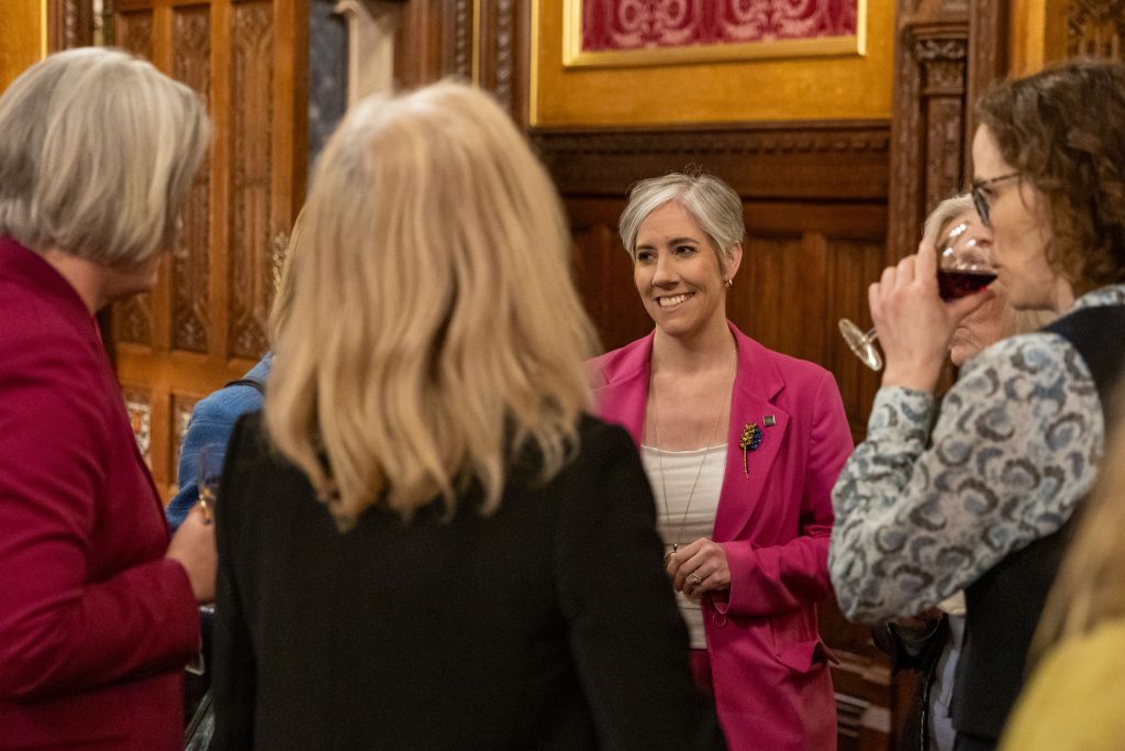 Daisy Cooper MP networking with guests