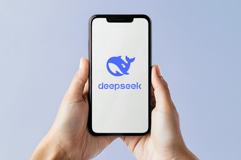 Hands holding a smartphone with the logo if DeepSeek AI